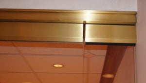 custom all-glass door header detail