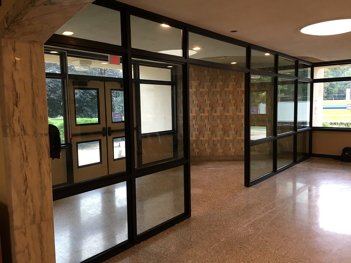 A photo showcasing how bulletproof solutions can be installed in the front doors of schools, alongside bulletproof classroom doors, bulletproof safe rooms, and more