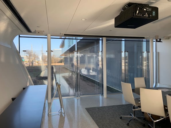 Conference room windows made of ballistic glass can be a key component of a corporate security strategy 