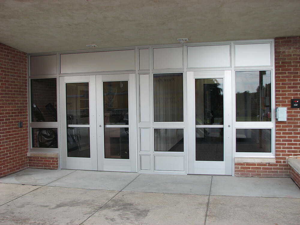 A photo showcasing aluminum bullet-resistant doors used on the exterior of a building