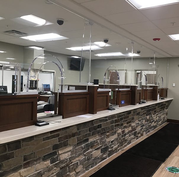 A suitable use application for a bulletproof currency tray that keeps employees safe as they interact with the public