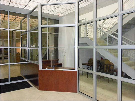 An example of a bullet proof window used in place of traditional glass windows to provide added protection for staff based on a client's specifications