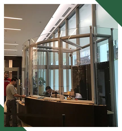 A secure entry area near the front doors of a building that help keep threats from the outside world out