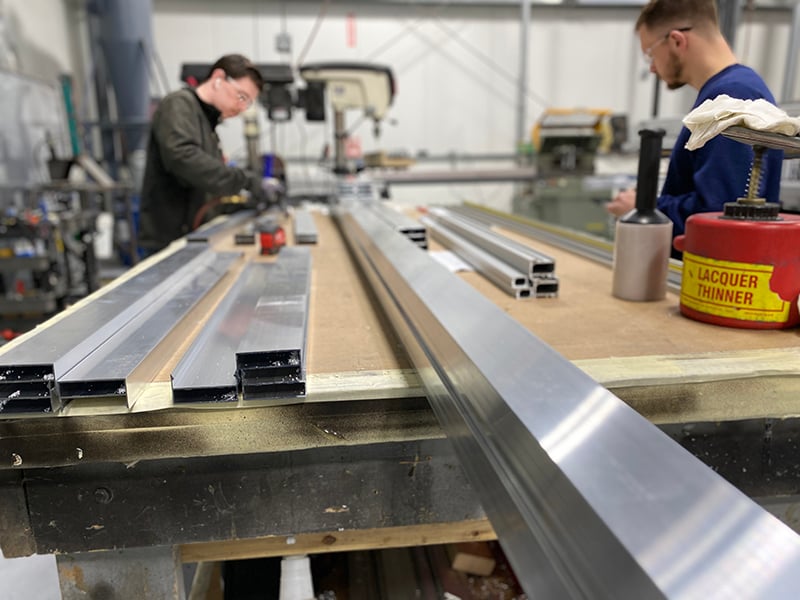 A photo displaying the craftmanship behind barriers equipped to stop buillets and make people safer across businesses, schools, and more