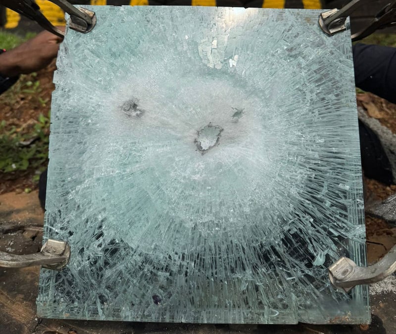 A photo depicts the impact of a bullet on TSS glass, as an alternative to shatter proof glass