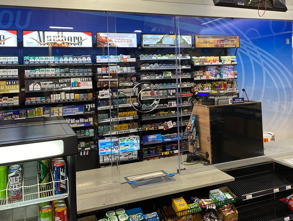 An example of a bulletproof window speak-thru in a retail store that allows for clear communication