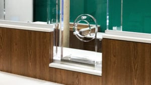 hole-and-backer style teller window for physical security in banks