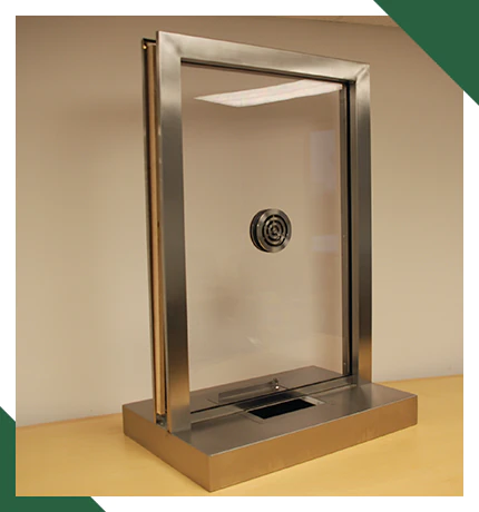 An example of stainless steel framing for a bulletproof transaction window
